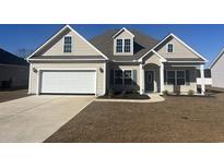 New construction home with a two-car garage and landscaping at 2347 King Farm Rd., Aynor, SC 29511