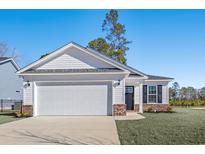 Craftsman style home with white siding, brick accents, and a two-car garage at 734 Woodside Dr., Conway, SC 29526