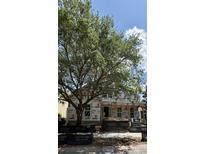 New construction home featuring a covered entryway with ample natural light and a large tree on the front lawn at 1521 James Island Dr., North Myrtle Beach, SC 29582