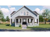 Charming two-story home featuring symmetrical windows, a covered porch, and a well-manicured lawn at 1521 James Island Dr., North Myrtle Beach, SC 29582