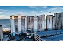 Exterior view of a beachfront resort showcasing the architecture, balconies and ocean views at 4800 S Ocean Blvd. # 1014, North Myrtle Beach, SC 29582