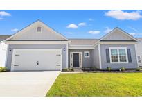 Gray house with white accents and a two-car garage at 1118 Cypress Shoal Dr., Conway, SC 29526