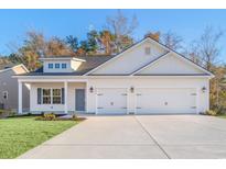 Newly constructed home with a three-car garage and attractive landscaping at 4410 Kinlaw St., Little River, SC 29566