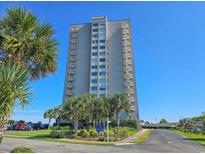 Stunning exterior view of Hampton Place's high-rise condo building with private balconies and beautiful landscaping at 9820 Queensway Blvd. # 1603, Myrtle Beach, SC 29572