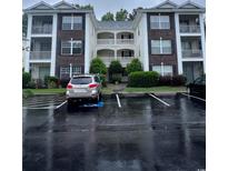 Brick building exterior with parking and landscaping at 1286 River Oak Dr. # 8-I, Myrtle Beach, SC 29579