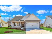 Charming craftsman style home with a two-car garage and manicured lawn at 301 Broughton Dr., Myrtle Beach, SC 29579