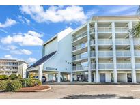 Eastport building exterior showing balconies and covered parking at 14290 Ocean Highway # 308, Pawleys Island, SC 29585