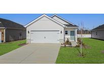 Craftsman style home with attached two-car garage and landscaped lawn at 773 Cypress Preserve Circle, Longs, SC 29568