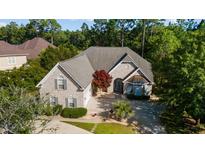 Beautiful home featuring brick exterior, gray roof, and well-manicured lawn at 2000 Kilkee Dr., Myrtle Beach, SC 29579