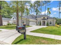 House exterior showcasing a two-story home with a charming front yard and driveway at 2844 Mcleod Ln., Myrtle Beach, SC 29588
