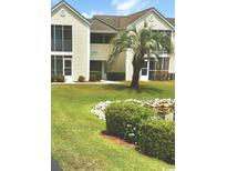 Attractive exterior of a two-story building with landscaping and a pond at 8925 Duckview Dr. # A, Myrtle Beach, SC 29575