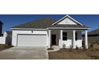 Charming single-story home with a white exterior, inviting entry, and a two-car garage at 380 Black Pearl Way, Myrtle Beach, SC 29588