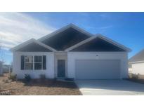 Two-story house with white and dark gray siding, and a two-car garage at 137 Pampa Dr., Loris, SC 29569