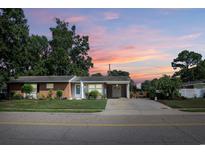 Charming single-story home with brick accents, mature trees, and a well-manicured lawn at 530 Swallow Ave. # 530, Myrtle Beach, SC 29577