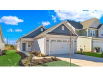 New construction home with gray and white exterior, two-car garage, and landscaped lawn at 622 Castle Ct., Myrtle Beach, SC 29579