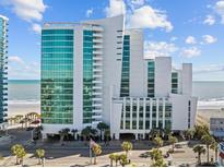 Oceanfront high-rise building with stunning ocean views and modern architecture at 201 S Ocean Blvd. # 1005, Myrtle Beach, SC 29577