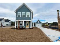 Two-story home with attached garage, and a landscaped yard at 2628 Rowyn St., Longs, SC 29568