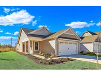 Charming single-story home featuring a two-car garage, manicured lawn, and inviting curb appeal at 626 Castle Ct., Myrtle Beach, SC 29579