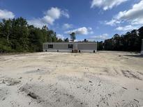 New manufactured home featuring a front porch and situated on a spacious lot at 2500 Newton Rd., Aynor, SC 29511