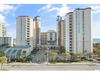 Oceanfront resort with multiple towers, parking, and tropical landscaping at 5200 Ocean Blvd. N # 631, Myrtle Beach, SC 29577