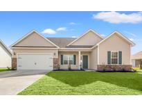 Charming single-Gathering home with a well-manicured lawn, brick accents, and a two-car garage at 343 Hayloft Circle, Conway, SC 29526