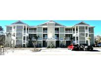 Two-story apartment building with light green exterior and balconies at 35 Delray Dr. # 1-E, Murrells Inlet, SC 29576