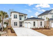 Stunning two-story home with a three-car garage and beautifully manicured front yard at 835 Waterton Ave., Myrtle Beach, SC 29579