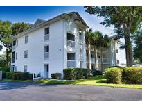 Condominium exterior featuring multiple floors and private balconies on a sunny day at 9550 Dunes Gable Dr. # F, Myrtle Beach, SC 29572