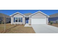 Two-story Craftsman home with a front porch and attached garage at 3851 Lady Bug Dr., Shallotte, NC 28470