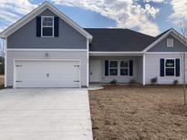 Charming single-story home with a two-car garage and classic design, perfect for modern living at 1060 Log Cabin Rd., Loris, SC 29569