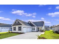 Craftsman style home with 3-car garage and landscaped lawn at 284 Starlit Way, Myrtle Beach, SC 29579