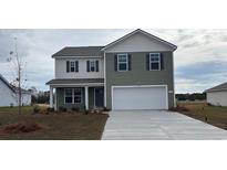 Two-story house with gray siding, white accents, and a two-car garage at 315 Acosta Circle, Conway, SC 29527