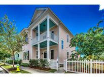 Charming two-story home featuring a welcoming porch and a classic white picket fence at 1348 Peterson St., Myrtle Beach, SC 29577
