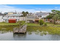 Charming waterfront cottage with private dock and marsh views at 209 N Dogwood Dr., Garden City Beach, SC 29576