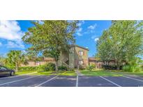 Inviting two-story condo with lush landscaping, exterior stairs and ample parking spaces at 305 Resort Dr. # C12, Myrtle Beach, SC 29588