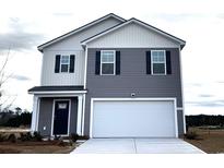 Two-story home featuring gray and white siding, black shutters, and a two-car garage at 323 Acosta Circle, Conway, SC 29527