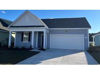 Charming single-story home with a two-car garage and a welcoming front porch at 551 Duvall St., Longs, SC 29568