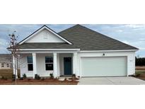 Charming single-Gathering home with white siding, covered porch, and two-car garage, ready for move-in at 819 Buttonwood Dr., Conway, SC 29527