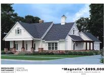 Charming exterior showcasing a stylish craftsman home with a mix of siding and stone and covered front porch at Lot 1-B Brace Dr., Pawleys Island, SC 29585