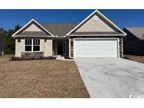 Charming single-story home features a two-car garage and a well-manicured lawn at 1223 Wehler Ct., Conway, SC 29526