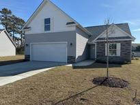 Charming one-story home with stone accents, gray siding, and an attached two-car garage at 1248 Wehler Ct., Conway, SC 29526