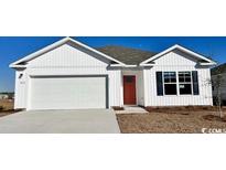 Charming one-story home with white siding, a two-car garage, and a welcoming red front door at 4573 East Coast Ln., Shallotte, NC 28470