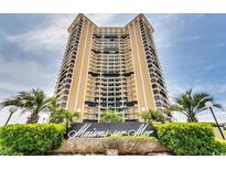 A large high-rise building with tropical landscaping and the Maisons-sur-Mer sign in the foreground at 9650 Shore Dr. # 1805, Myrtle Beach, SC 29572