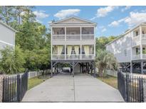 Two-story home with front porch and driveway at 3704 Chapel Ln., Myrtle Beach, SC 29588