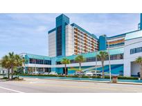 Stunning exterior view of the Landmark Resort with palm trees and ample parking at 1501 South Ocean Blvd. # 644, Myrtle Beach, SC 29577