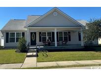 Charming one-story house with a front porch and well-maintained lawn at 1539 Stilley Circle, Conway, SC 29526