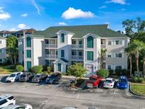 Multi-level condo building with ample parking, well-maintained landscaping, and attractive architectural details at 1100 Commons Blvd. # 104, Myrtle Beach, SC 29572