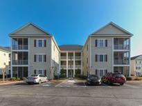 Condo complex with well-maintained landscaping and ample parking at 2060 Cross Gate Blvd. # 305, Surfside Beach, SC 29575