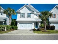 Charming two-story home with a two-car garage and eye-catching, light-blue, front-door at 4808 Cantor Ct., North Myrtle Beach, SC 29582
