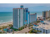 A stunning multi-story condo with ocean views, a pool, and beautiful landscaping at 3000 N Ocean Blvd. # 1601, Myrtle Beach, SC 29577